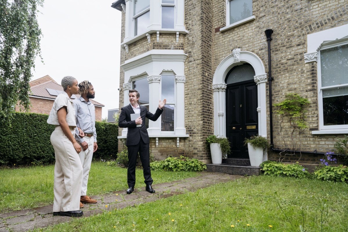 old houses - real estate showing home to couple