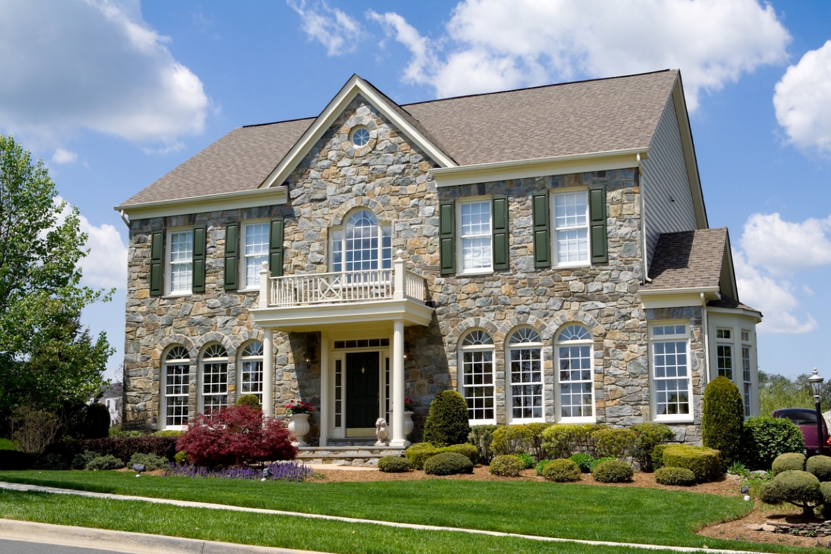 old houses - mcmansion with stone front