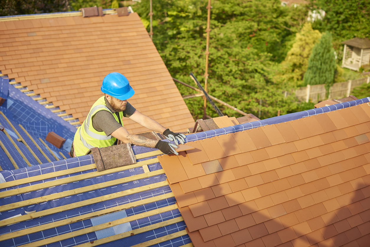 old houses for sale roofer installing tiles