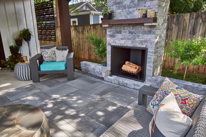 Pavestone patio and outdoor fireplace - outdoor living trends 2022