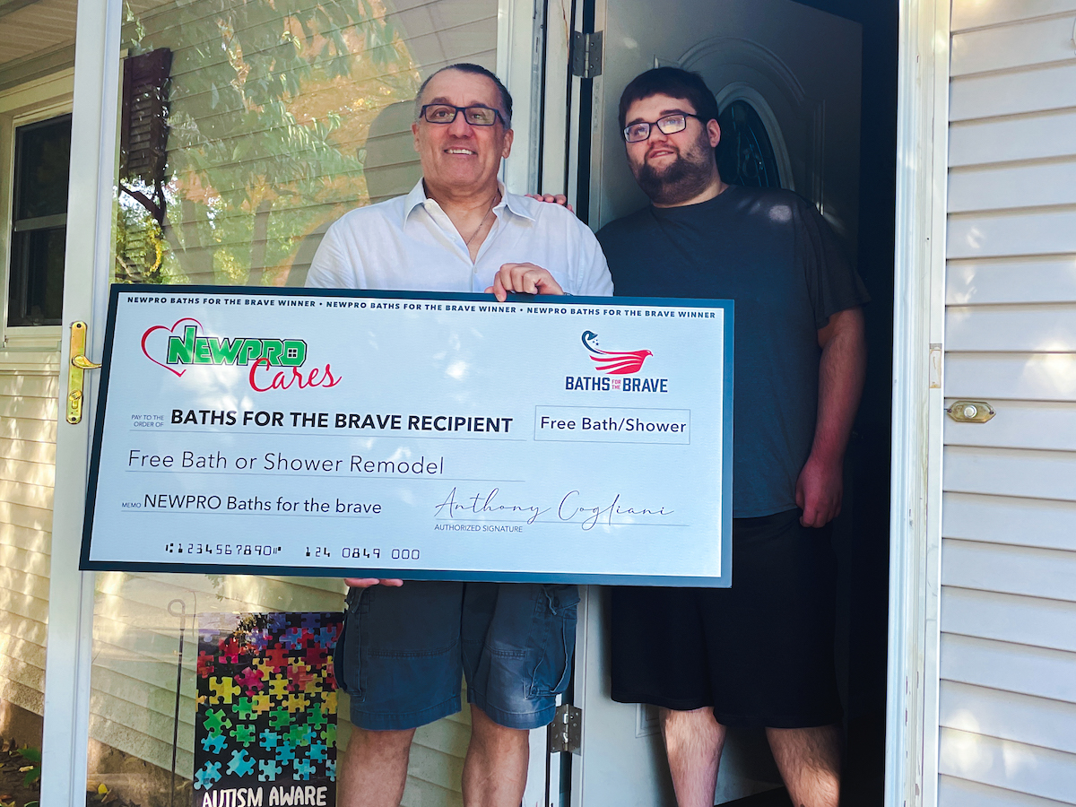 Baths for the Brave on Veterans Day Edward and Joshua Demars receive check for new bath