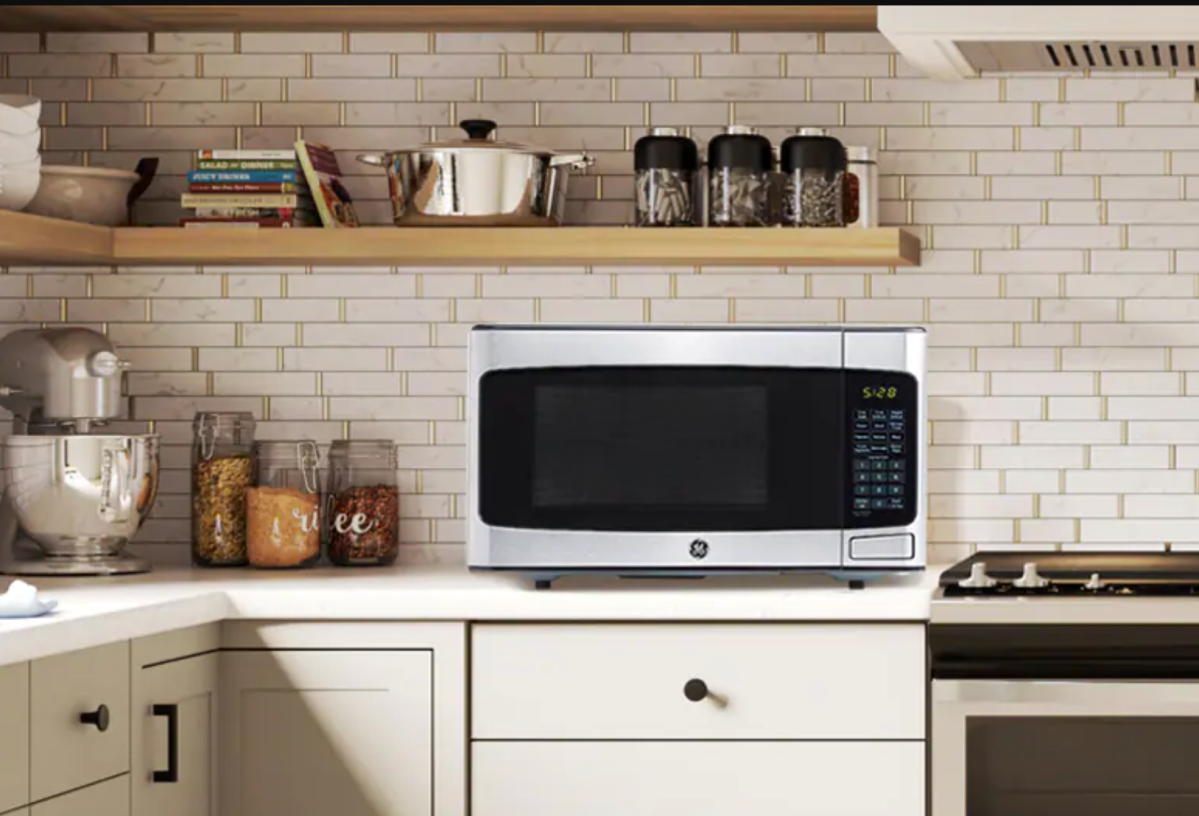 A small toaster oven sitting on a counter.