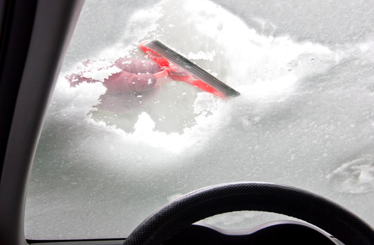 Things You Can Use When You Don't Have an Ice Scraper - orange plastic snow scraper