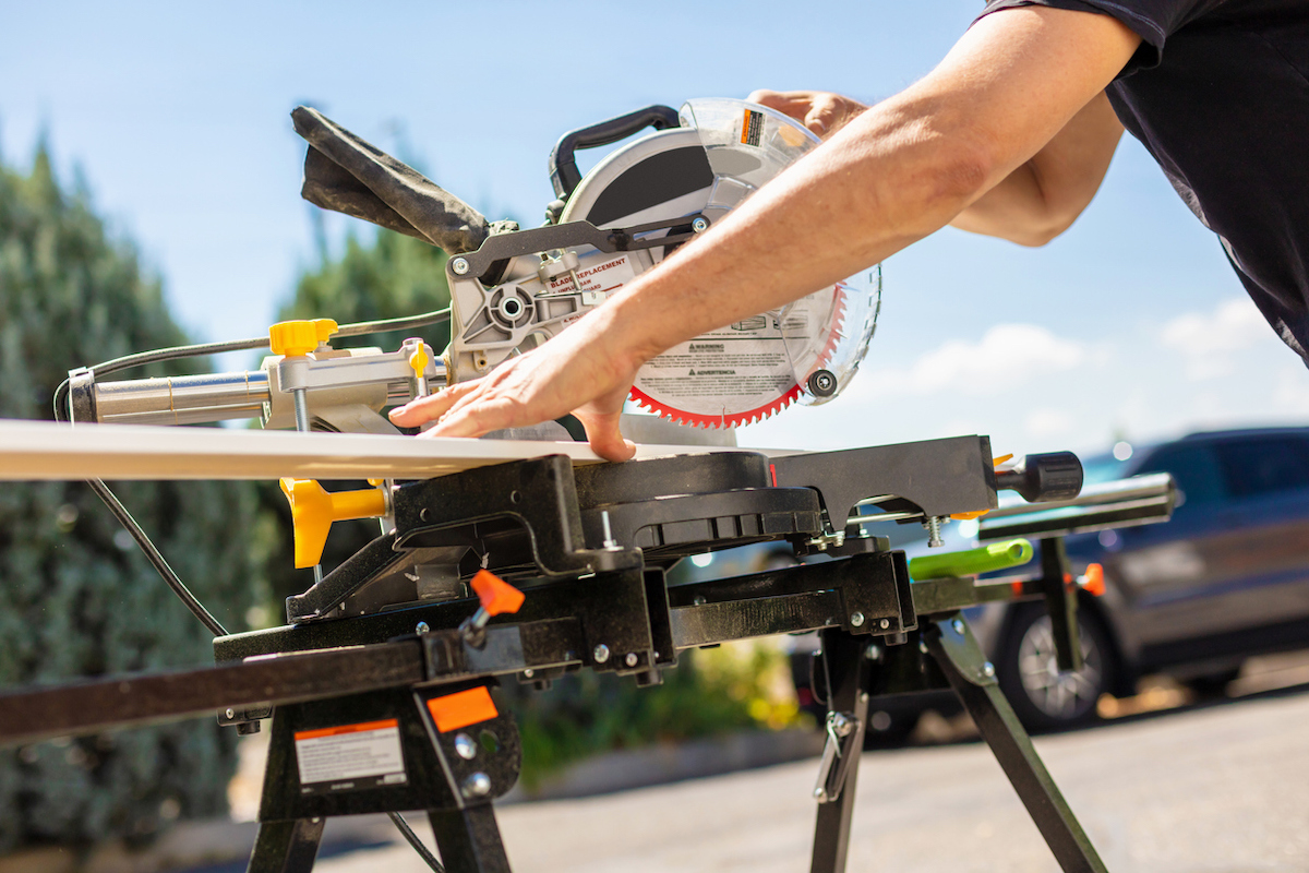 diy board and batten wall - cutting boards to size with miter saw