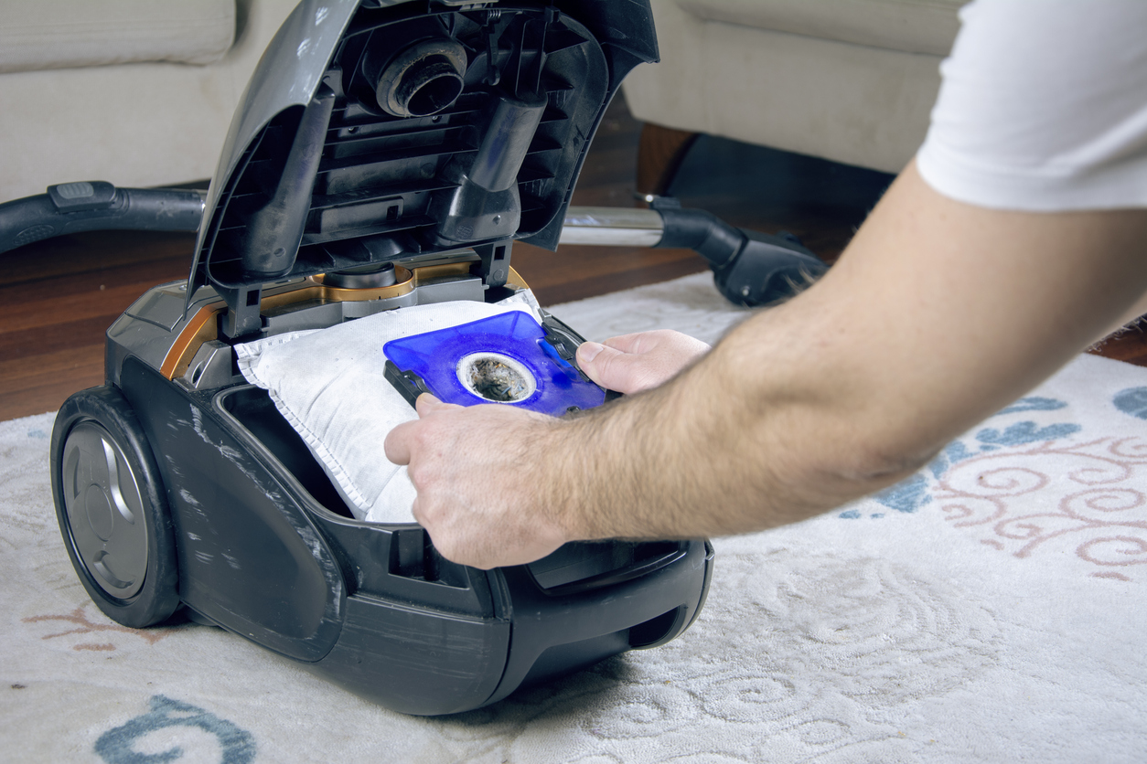 iStock-1308976941 bad habits emptying dust bag in vacuum.jpg