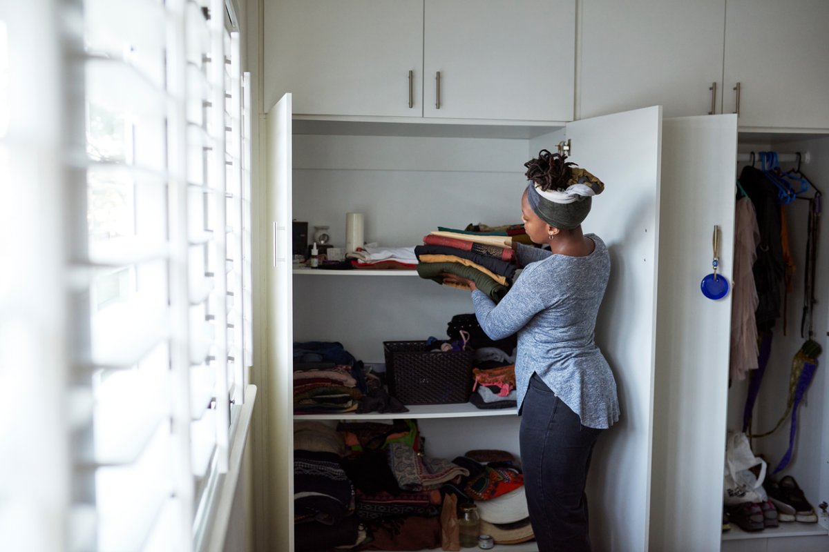 iStock-1281597360 must do february projects woman organizing closet