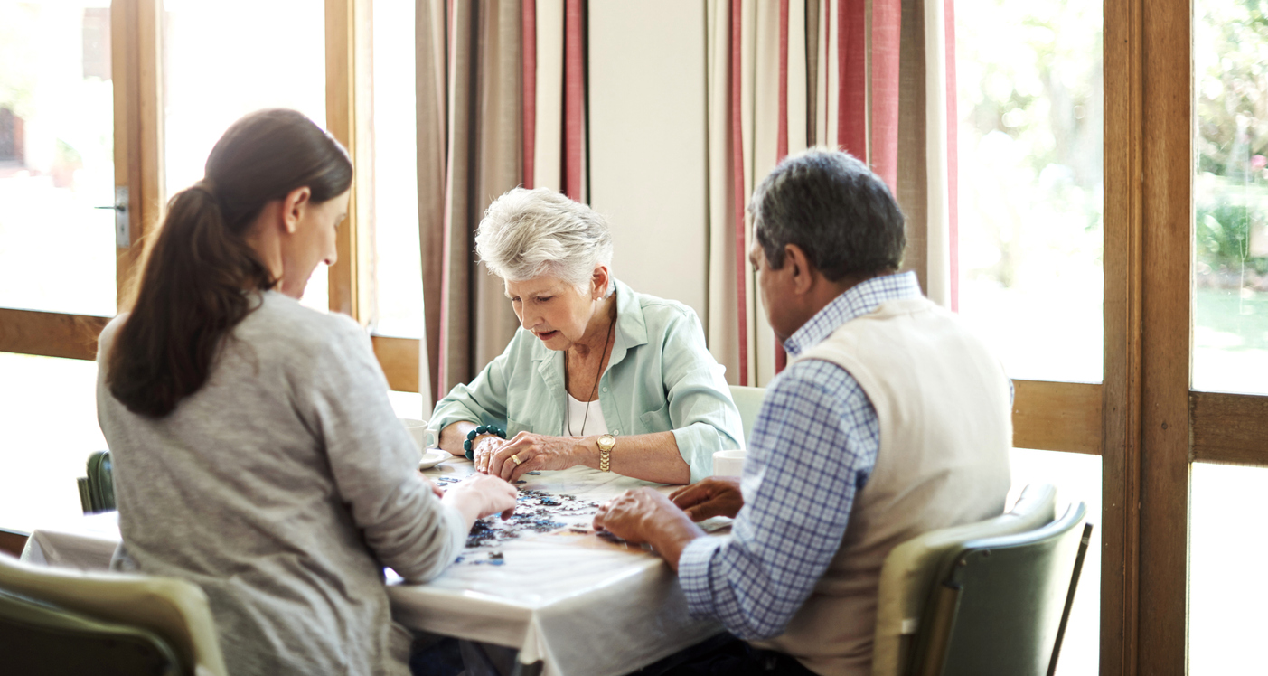 iStock-649643486 volunteer opportunities doing a puzzle at a senior citizen center