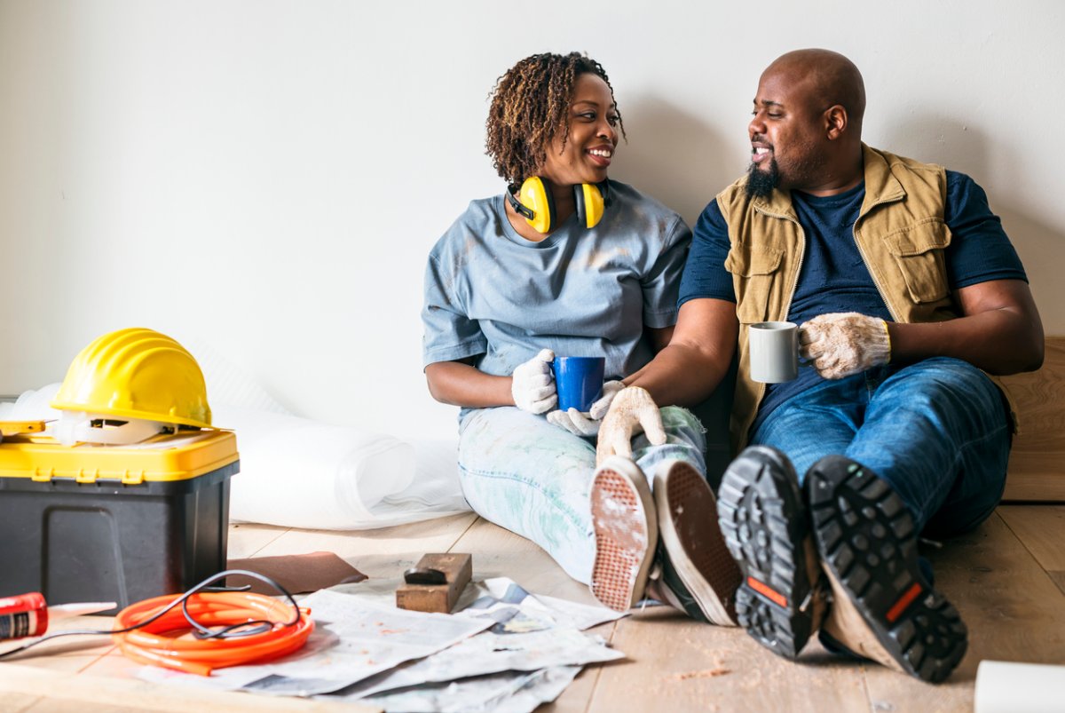 iStock-929448950 over improve a house couple discussing renovations