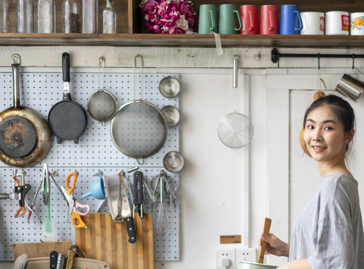 A young Asian woman in the kitchen