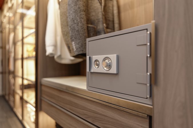 locked safe inside closet with clothes