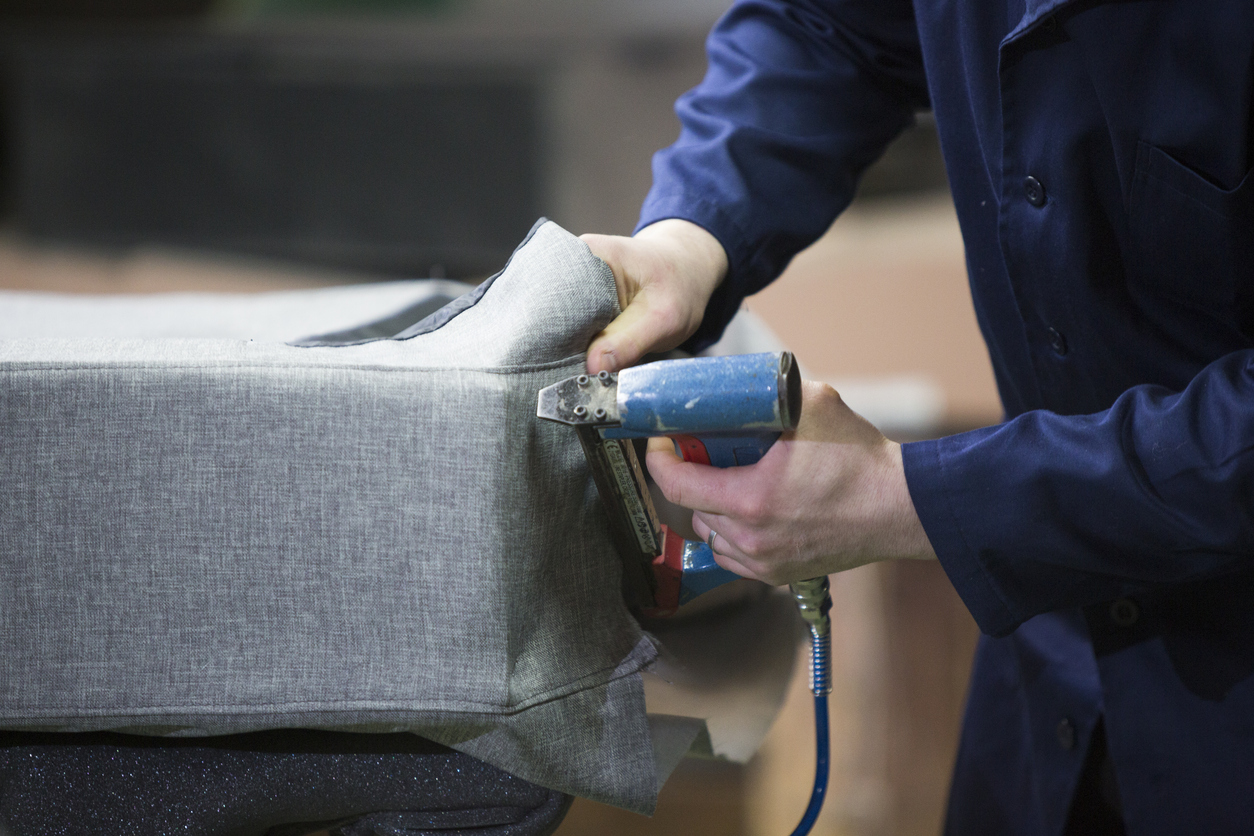 how to reupholster a couch using staple gun to attach new fabric to couch