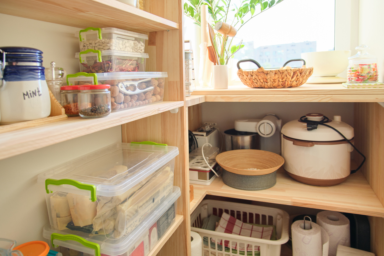 iStock-1160741785 disguise appliances appliances tucked behind pantry counter