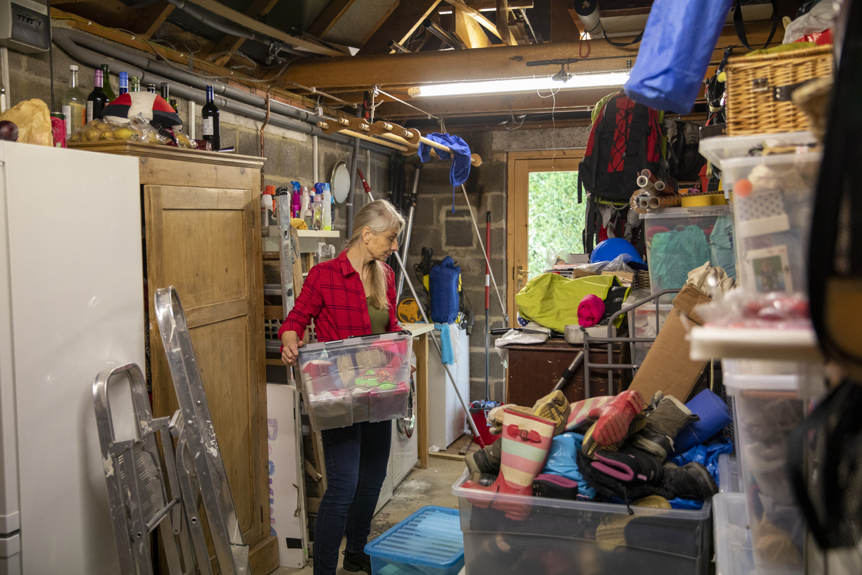 iStock-1226048693 2023 bob vila editor projects woman cleaning garage