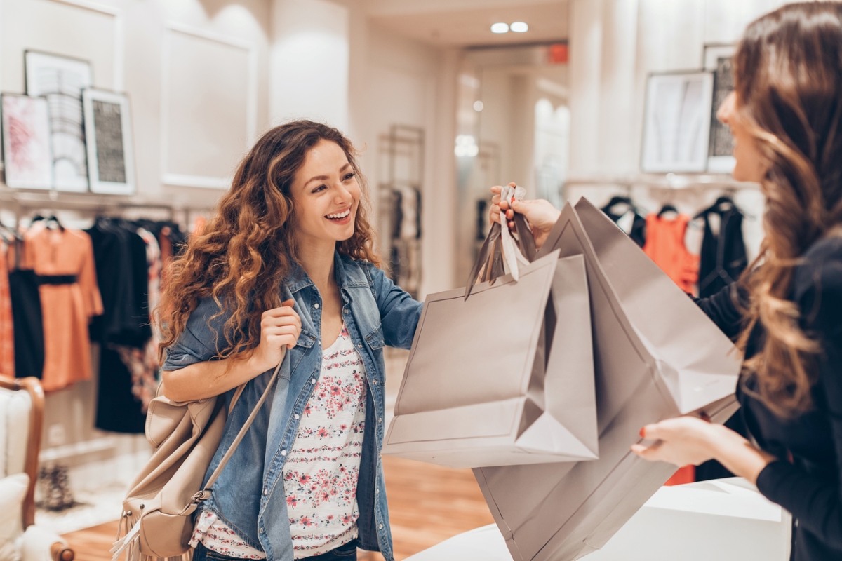 daylight savings time 2023 - young woman handed shopping bags