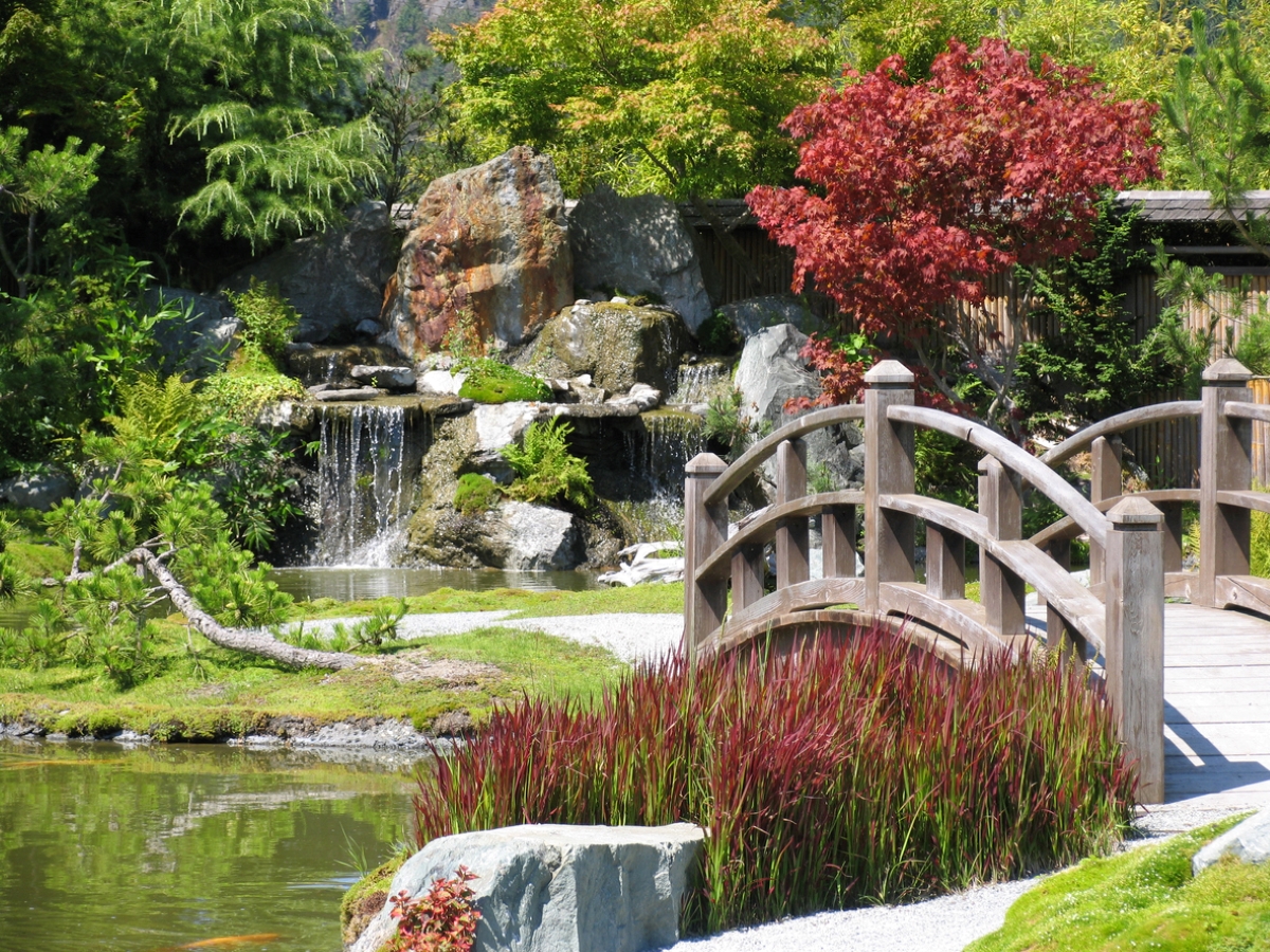 zen garden ideas - japanese pond garden with bridge