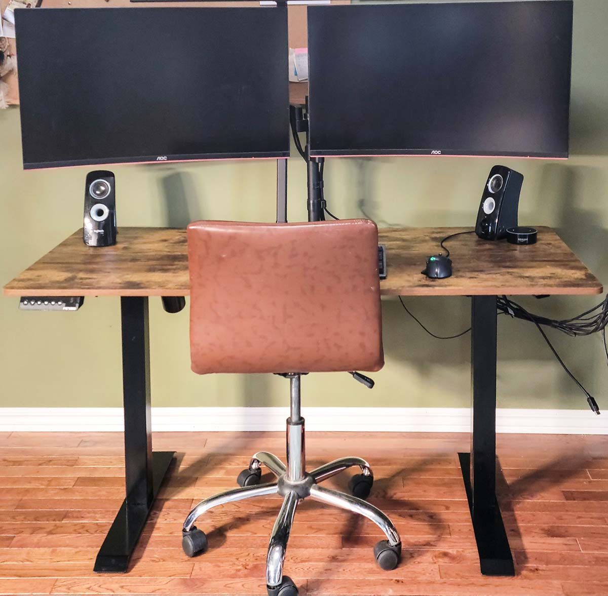 The Fezibo standing desk in its lowered position holding a dual-monitor computer setup