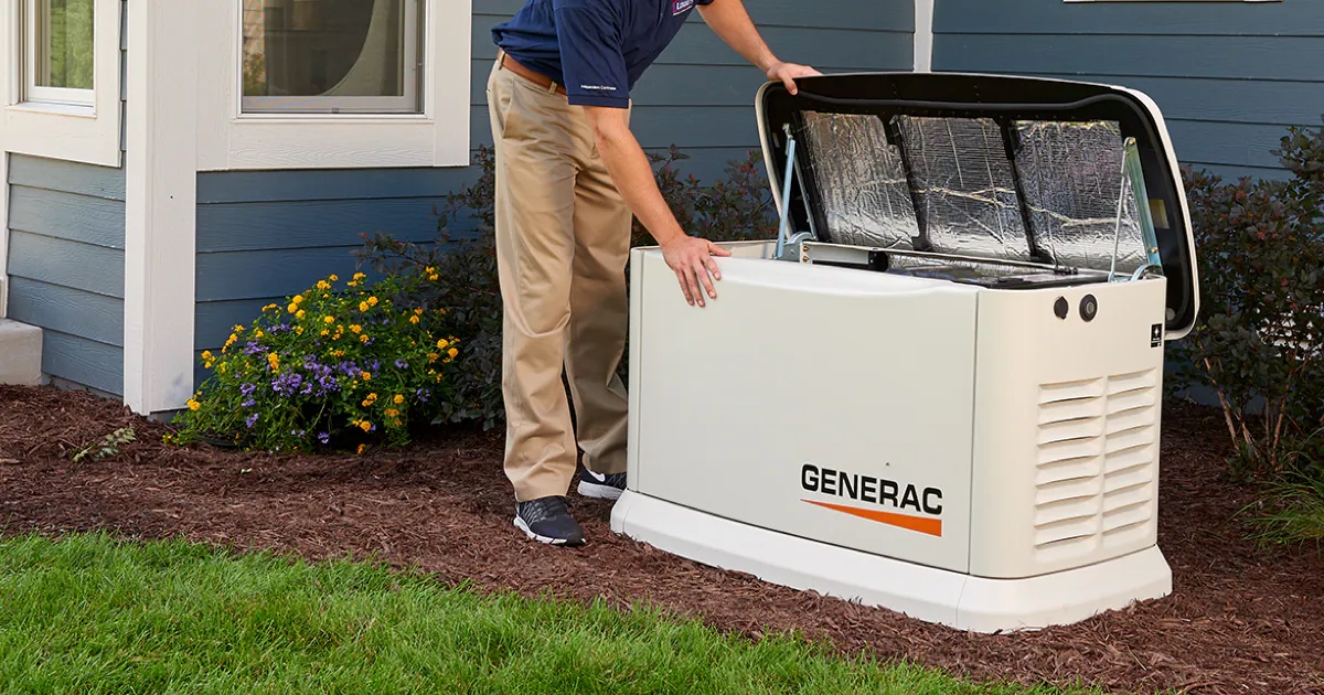 A person is looking inside a home generator.