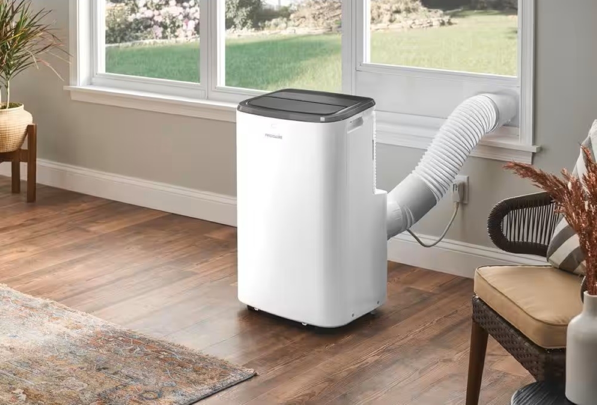 Portable air conditioner with vent to window