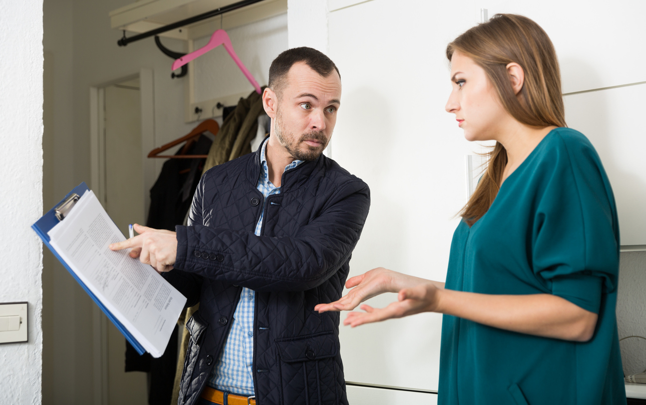 upset landlord and tenant talking to each other