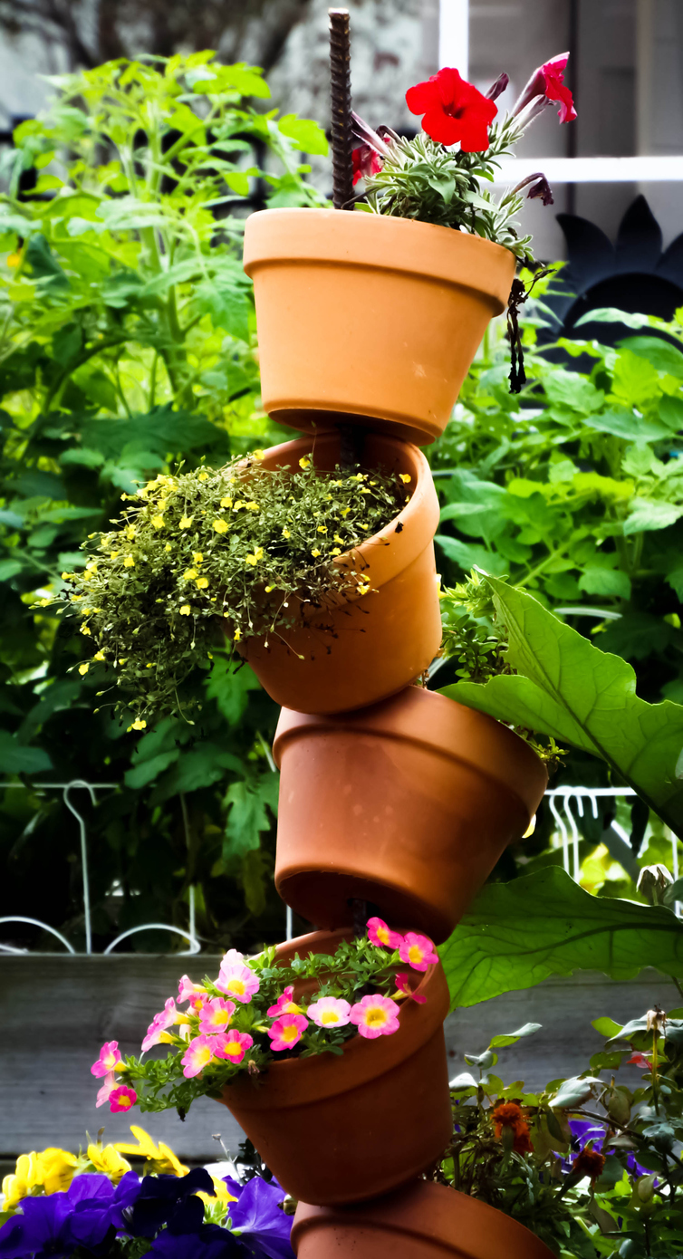 stack of flower pots in backyard