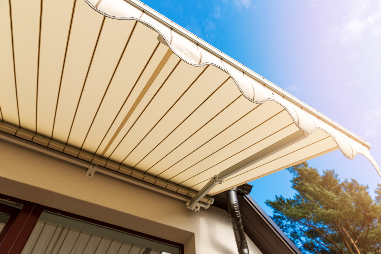 tan patio awning on side of house