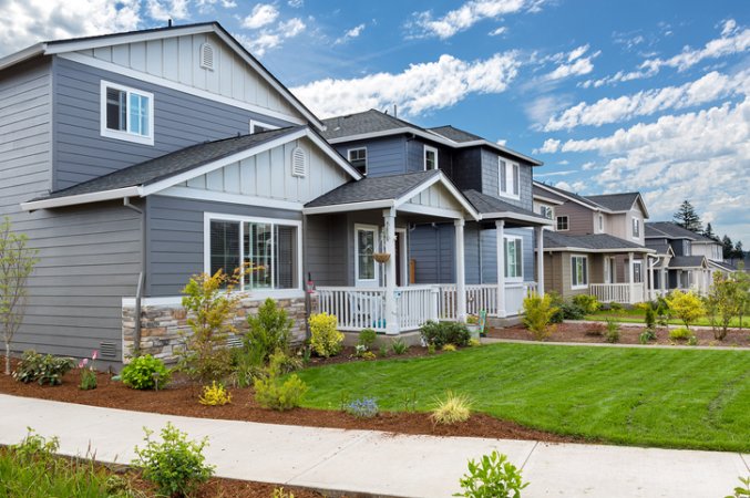 master-planned-community-block-of-grey-houses-in-same-style-with-green-yards