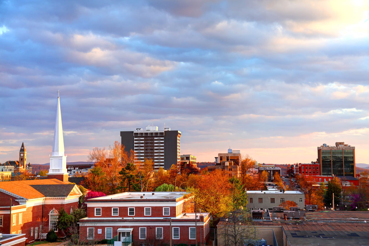 arkansas town autumn downtown church steeple orange trees cloudy sky