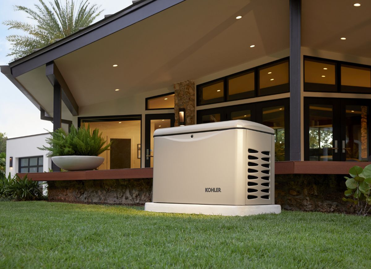 Kohler generator outside near deck in daytime