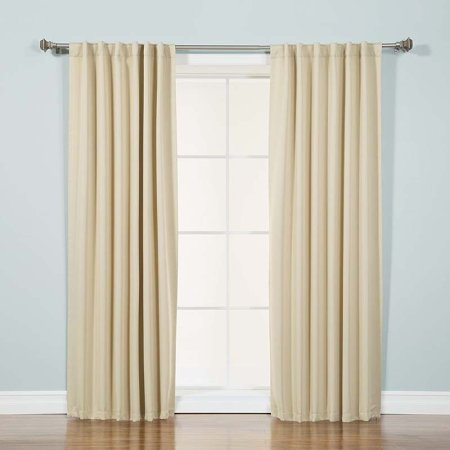  The Best Home Fashion Wide Basic Thermal Blackout Curtain installed over a patio door.