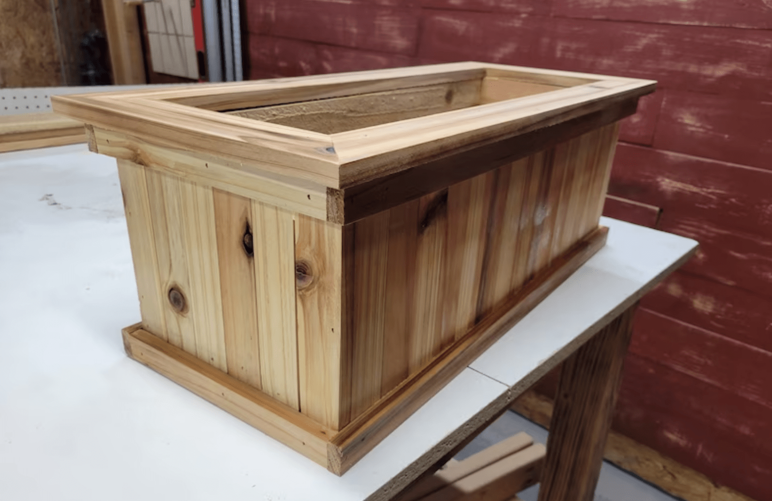 rectangular planter box made of cedar wood on top of workshop table