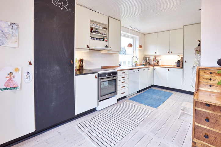 white-kitchen-with-beige-floor-and-a-chalkboard-paint-pantry-door