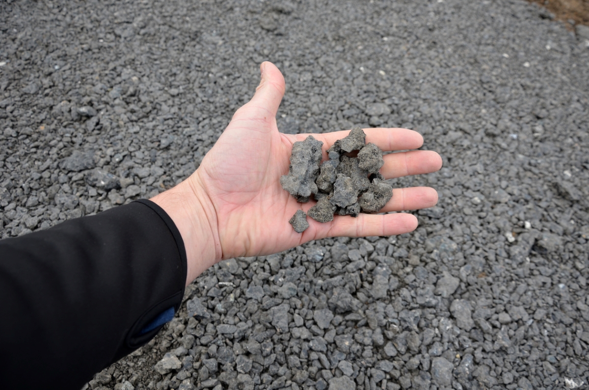 Person holding recycled concrete