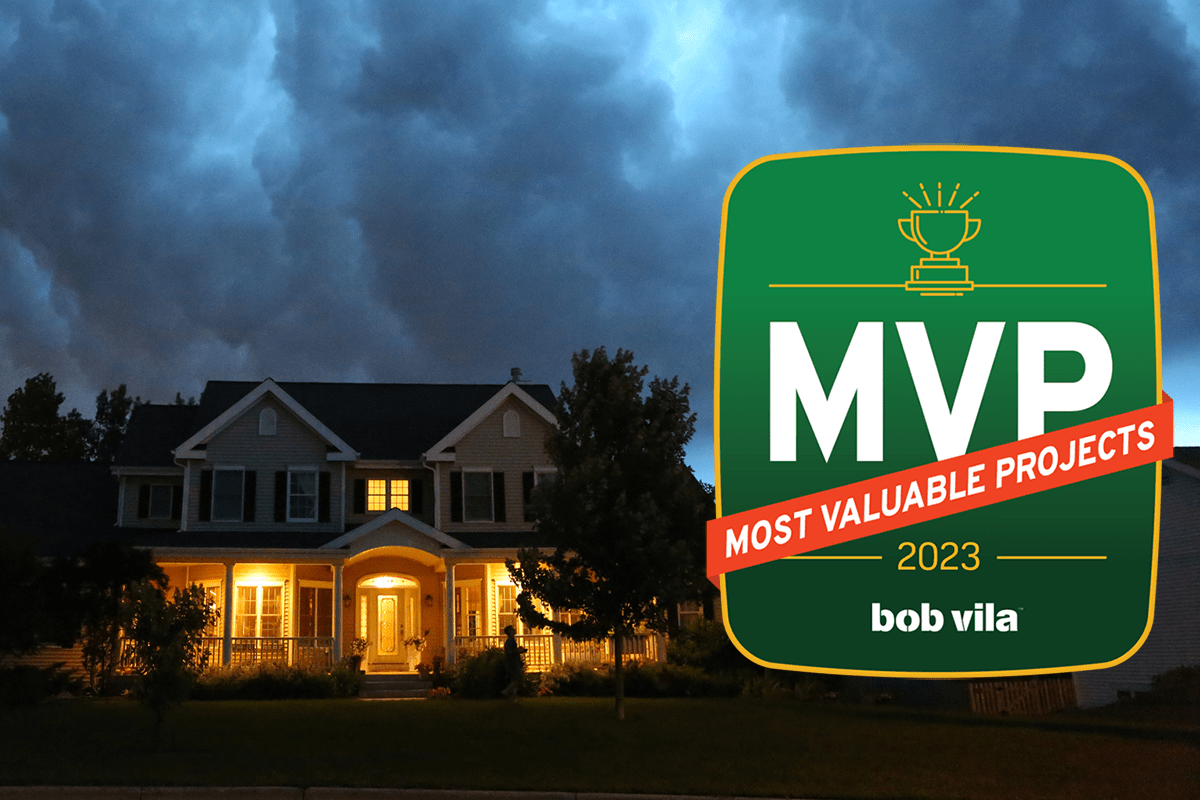 home with lights on with storm overhead and Bob Vilas most valuable projects 2023 graphic overlay