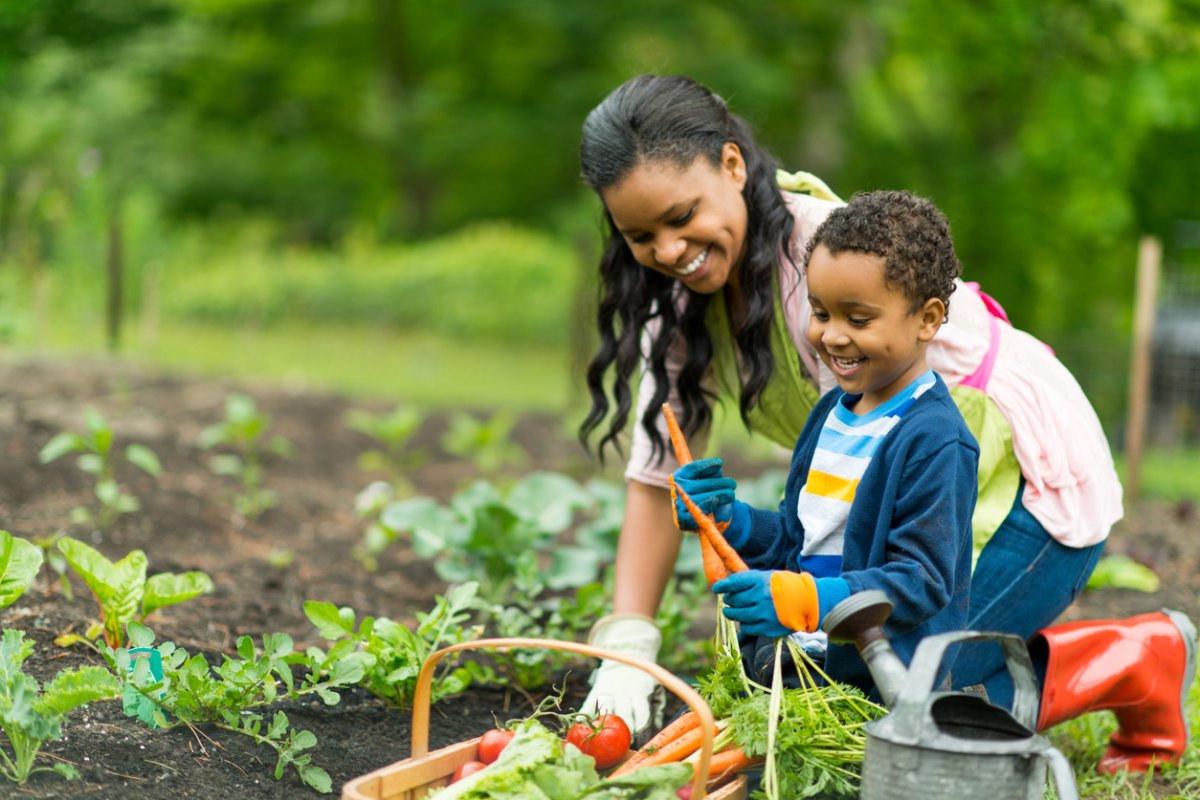 Mother and son gardening together