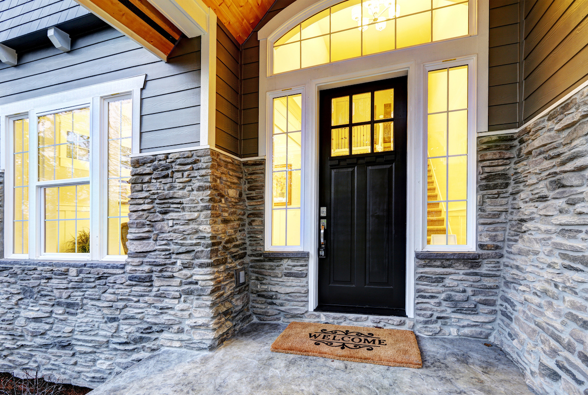 modern home exterior with new entry door and windows for energy efficiency