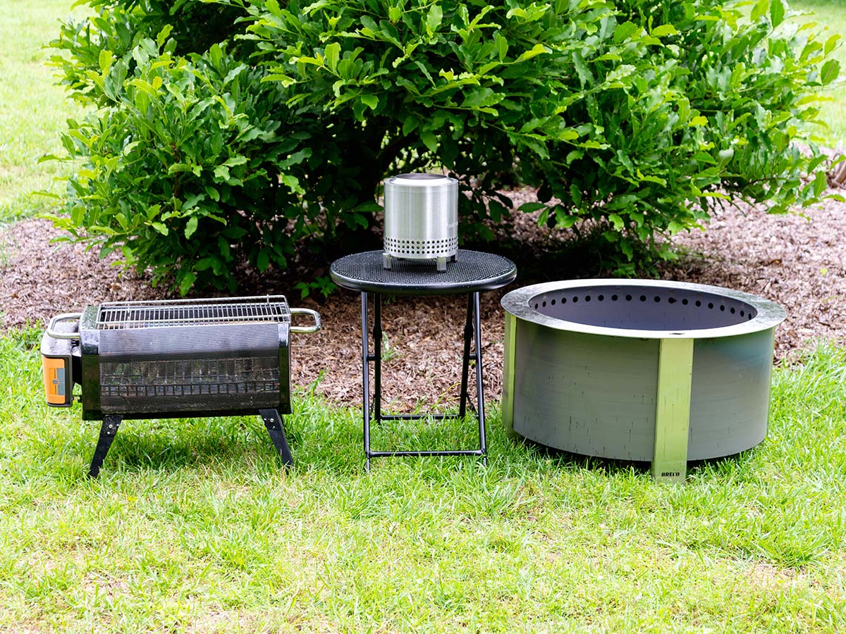 A group of the best fire pits on a lawn before testing.