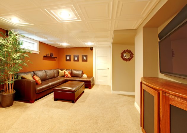 TV media basement living room with leather sofa.