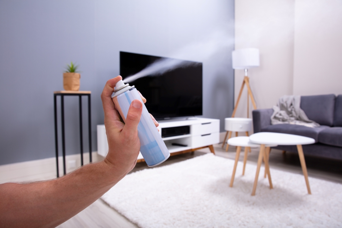 Person using air freshener