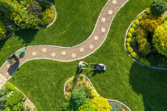 Aerial view of person mowing lawn