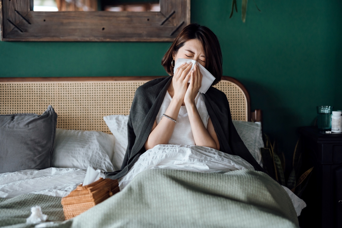 Woman blowing her nose