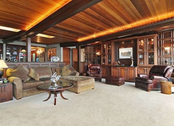 Basement with natural stained wooden rafters