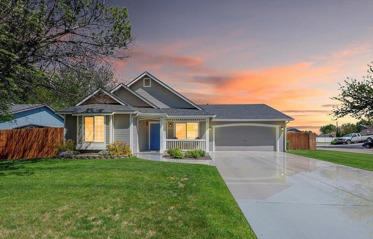 Home with garage during sunset