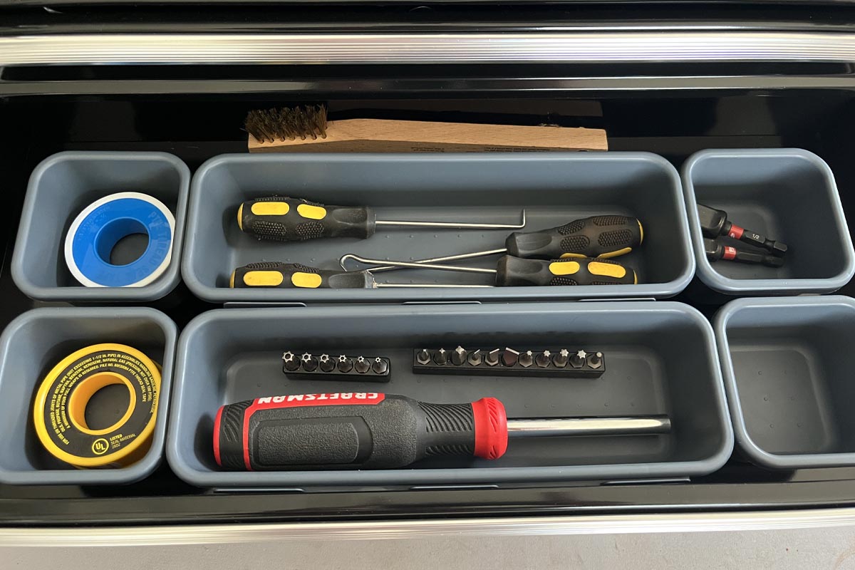 KeFanta tool box organizer trays inside a tool box holding screwdrivers, screws and tape