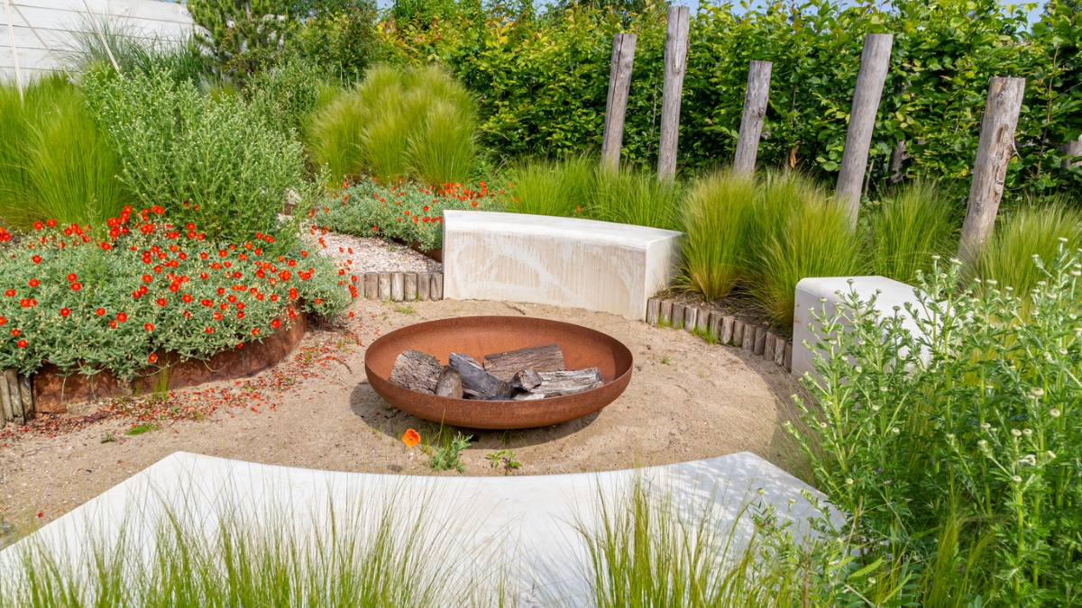 Outdoor beach patio with metal firepit