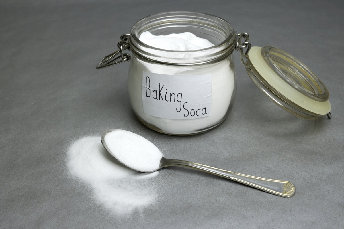 Baking soda isolated on gray background