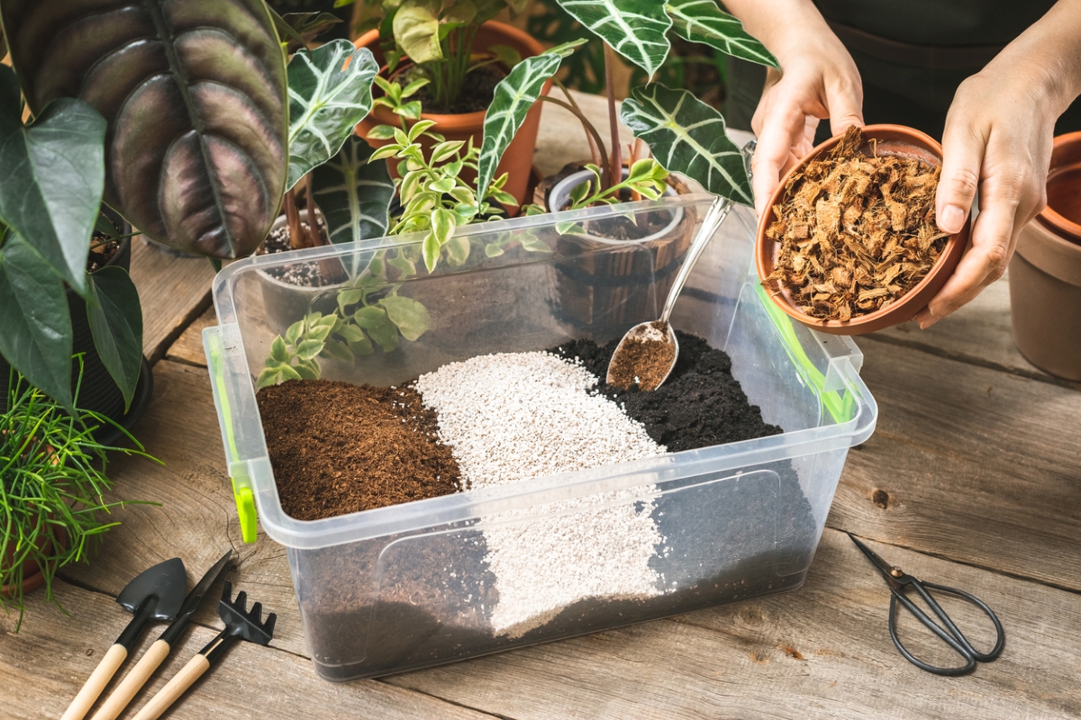 Gardener mixing potting soil