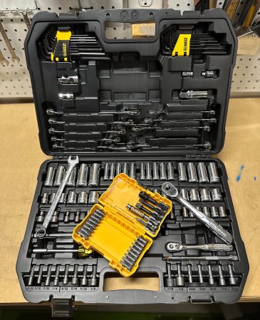 The DeWalt mechanics tool set open on a workbench