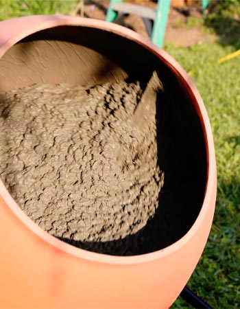 The interior of the Kushlan concrete mixer full of mixed cement ready for use