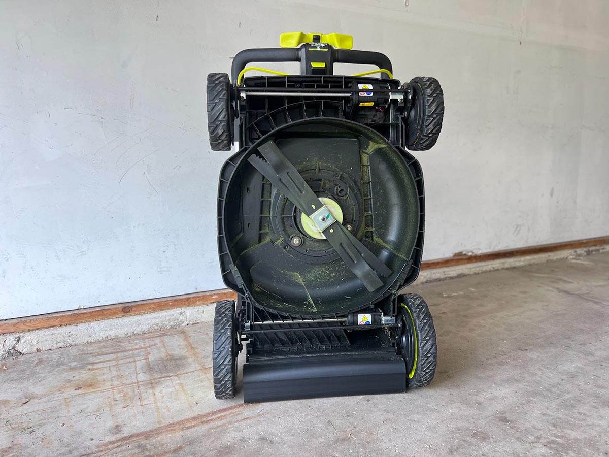 The underside of the Ryobi 21-inch self-propelled all-wheel-drive mower showing its cross-cut multiblade system