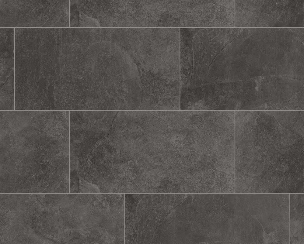 Closeup view of dark grey ceramic tiles with light grey grout.